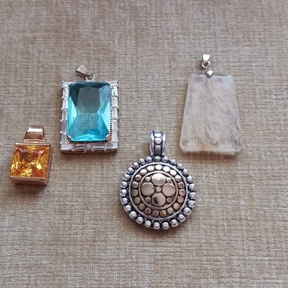 Collection of 4 Silver and Gold Tone Pendants